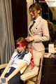 A woman sitting in a chair with a blindfold on her face.